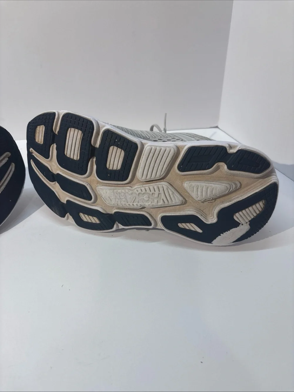 Hoka women’s size 7 gray/peach Bindi 7 style #110531 LRBI in fair condition.